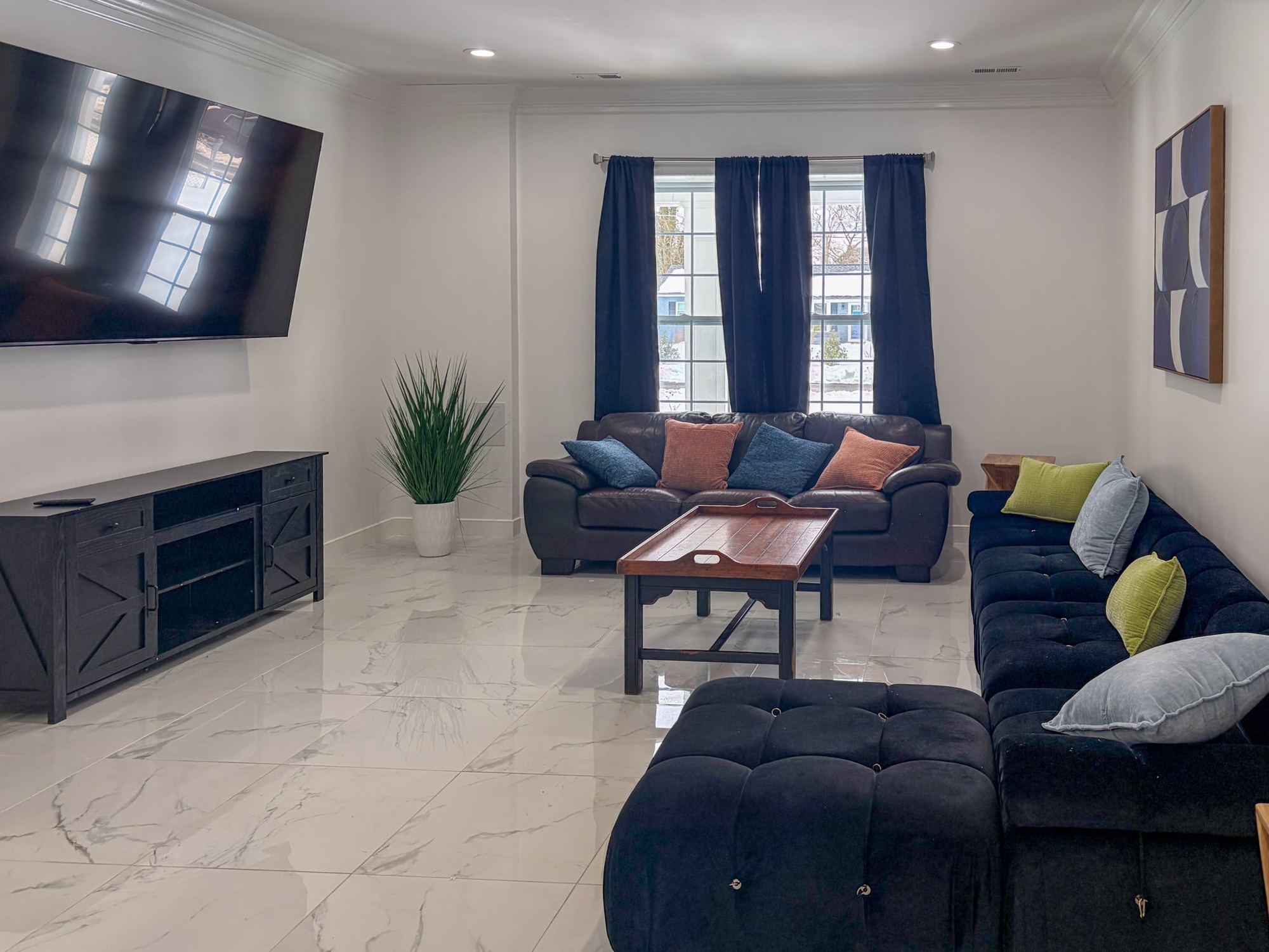 The lounge with navy sofas at the Alexandria home
