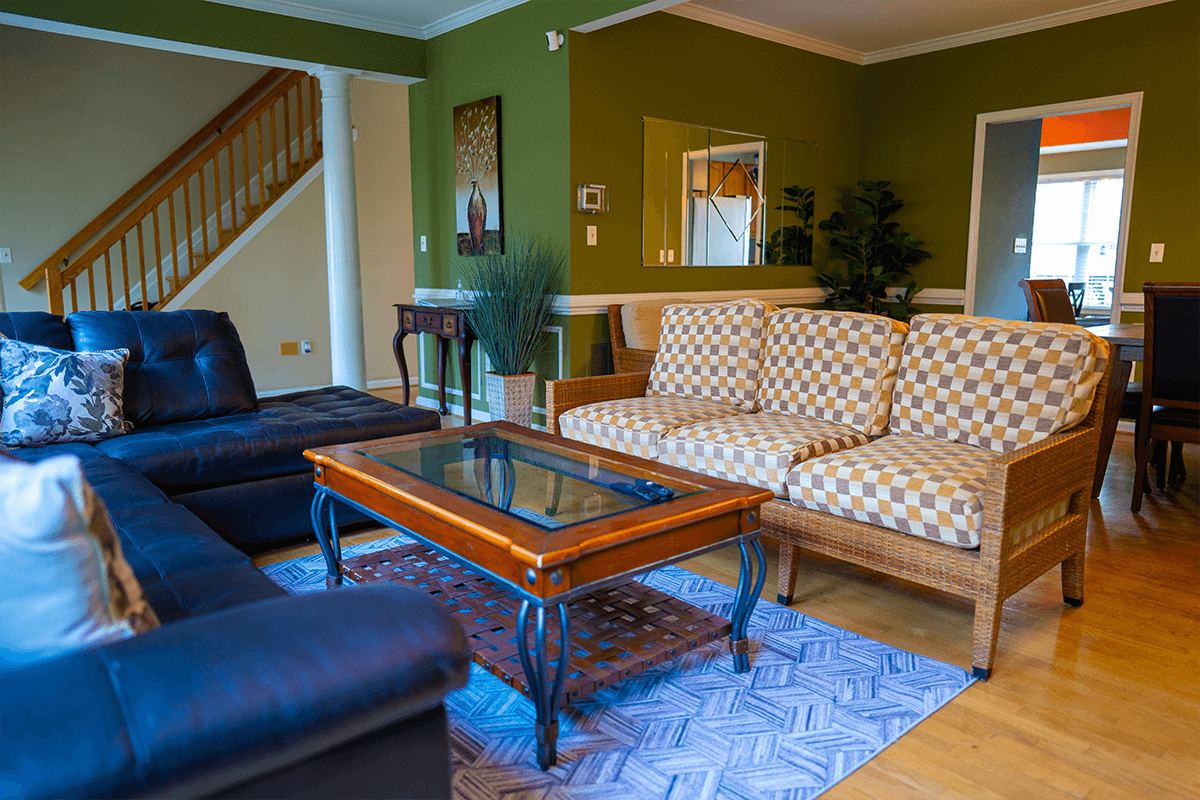 The green common room beside the stairs at the Arnold home
