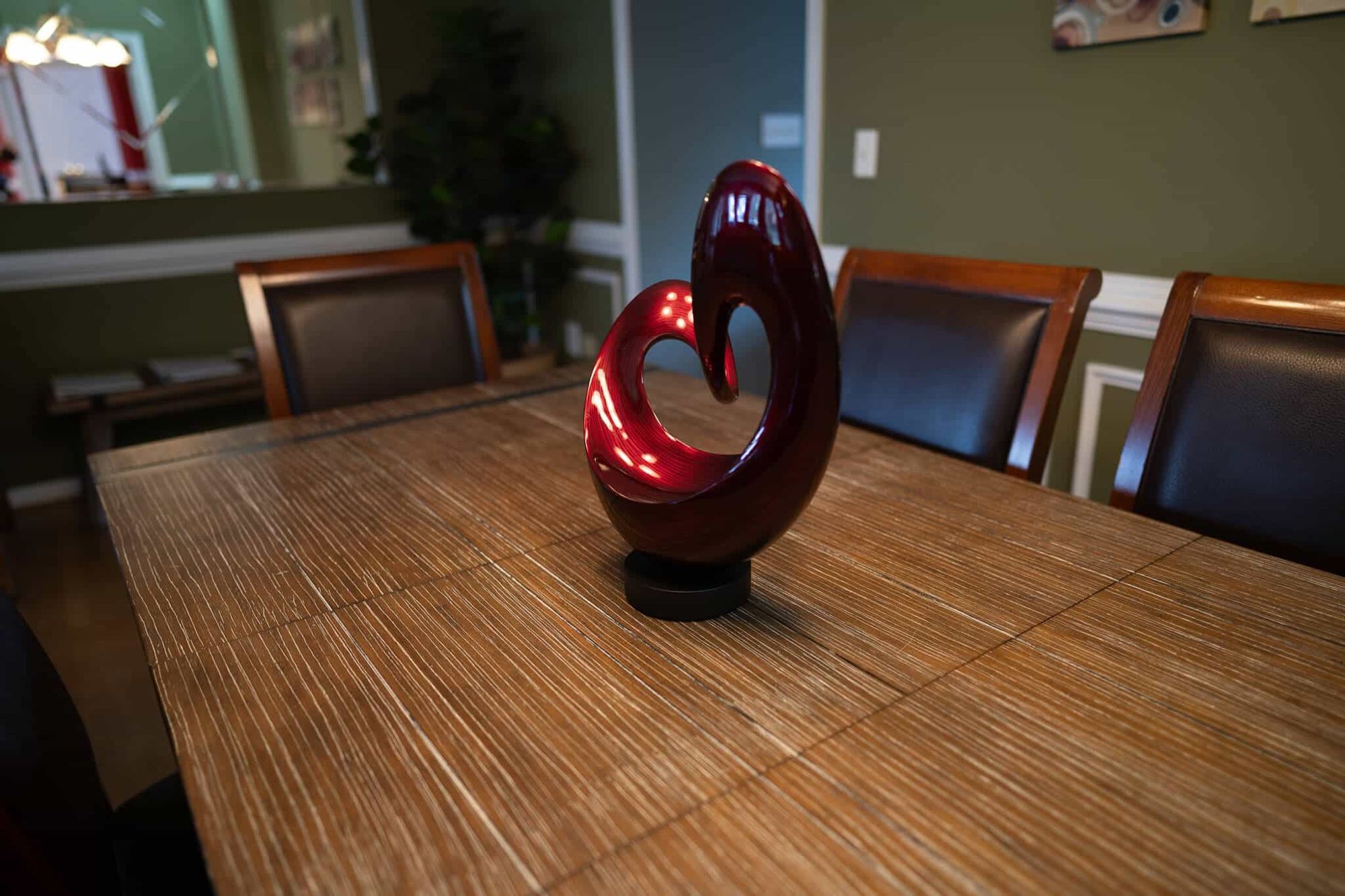 A red sculpture on the dining table at the Arnold home