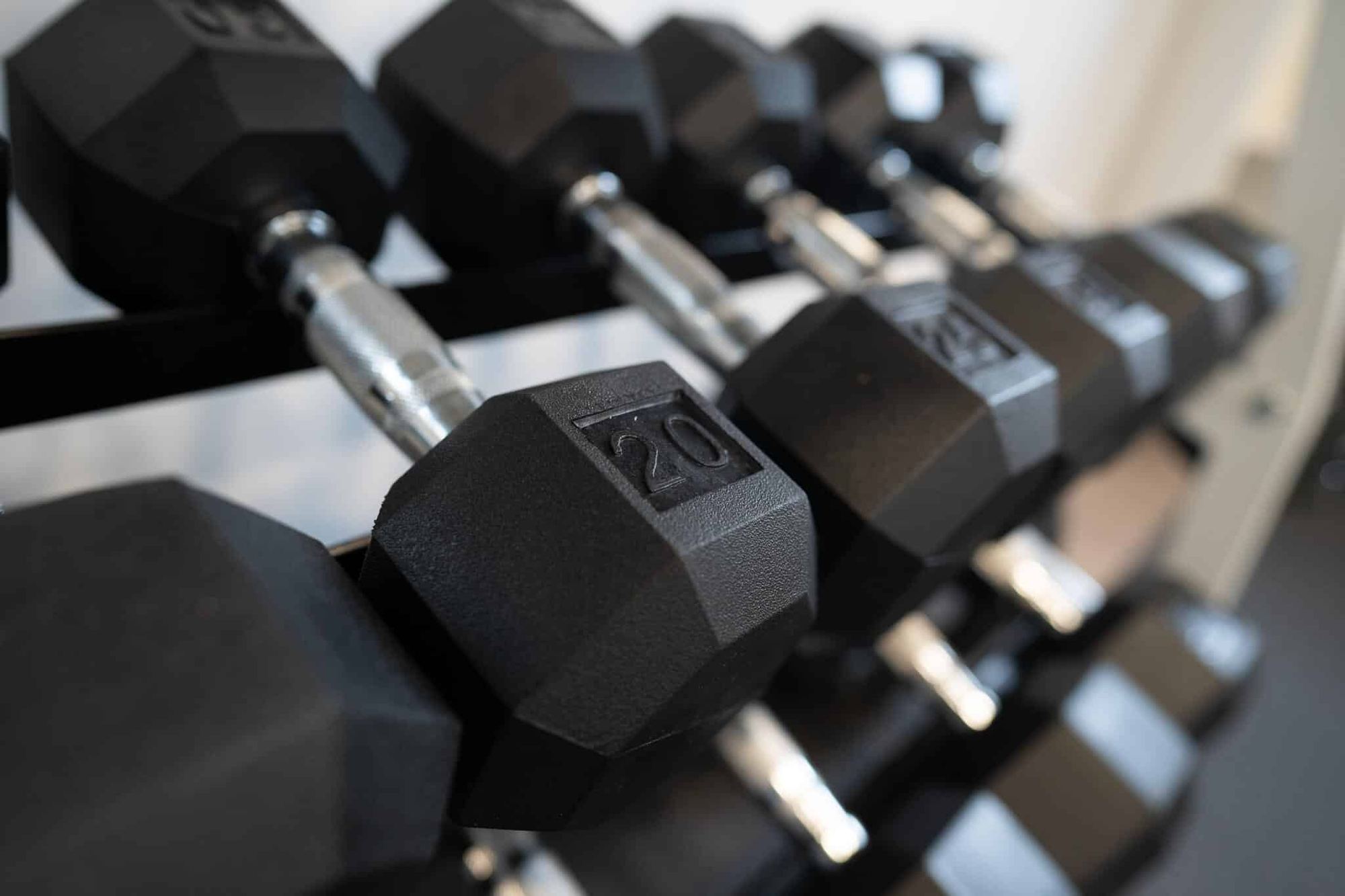 A rack of hex dumbbells in the gym at the Arnold home
