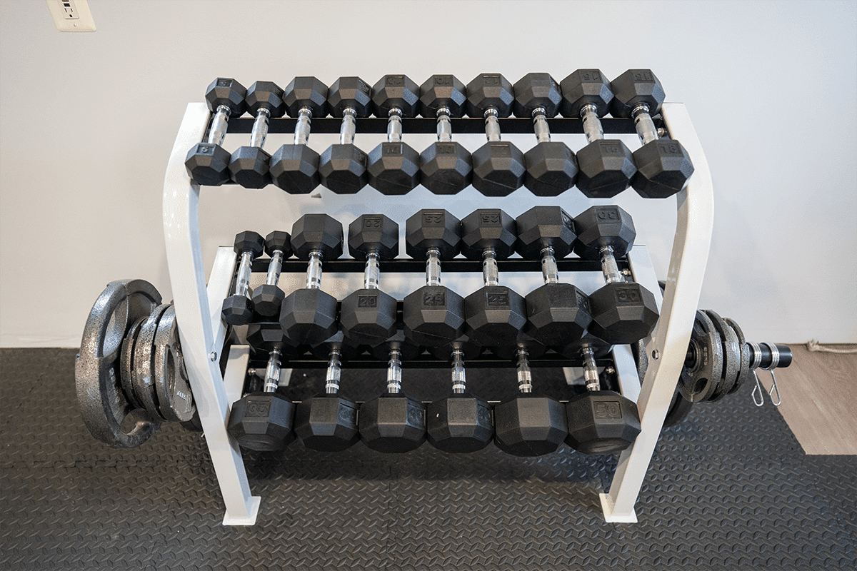 A dumbbell rack in the gym at the Arnold home
